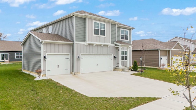 view of front of property with a garage and a front lawn