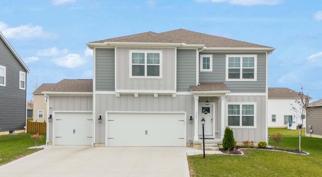 view of front of property featuring a garage and a front yard