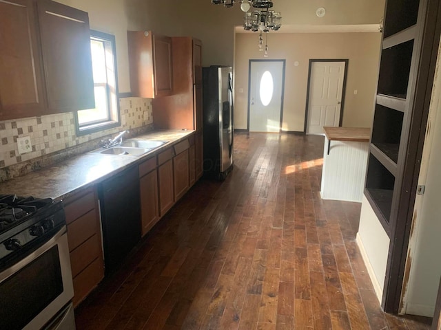 kitchen with stainless steel fridge, dark hardwood / wood-style flooring, sink, and white range with gas cooktop