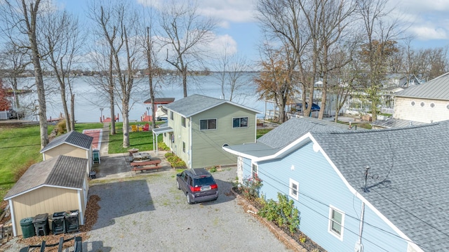 view of property exterior with a water view