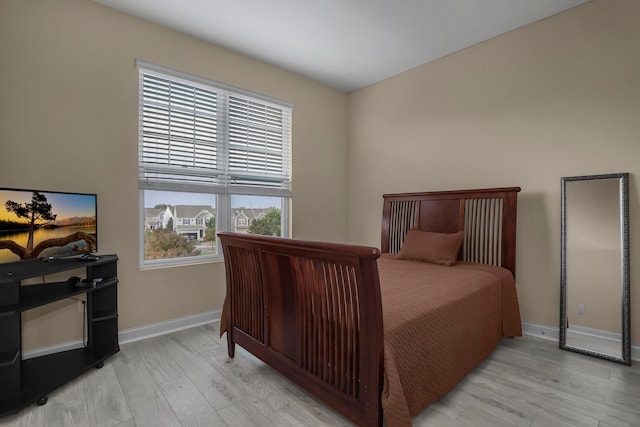 bedroom with light wood-type flooring