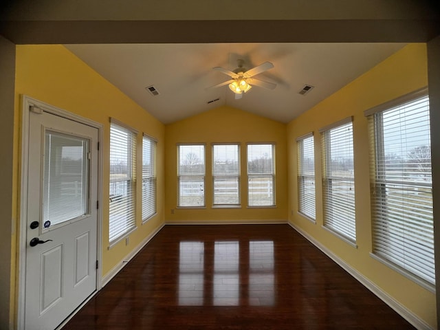 unfurnished sunroom featuring lofted ceiling, plenty of natural light, and ceiling fan