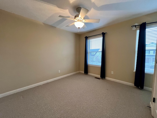 unfurnished room with light carpet and ceiling fan