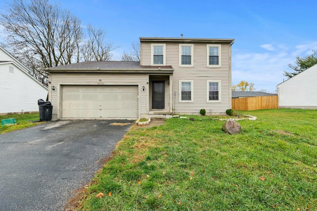 front of property featuring a garage and a front lawn