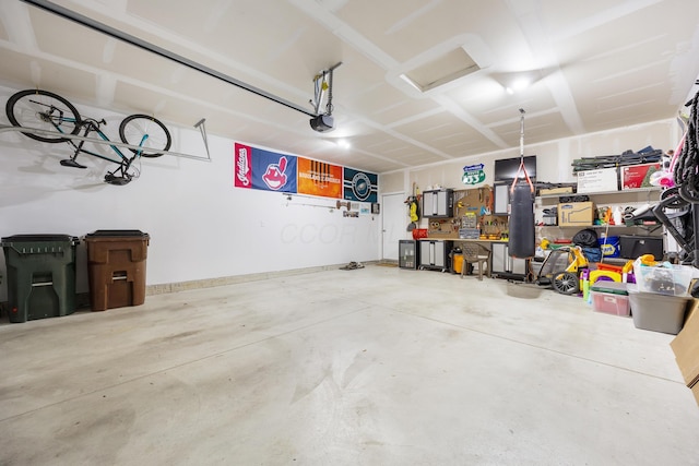 garage featuring a workshop area and a garage door opener