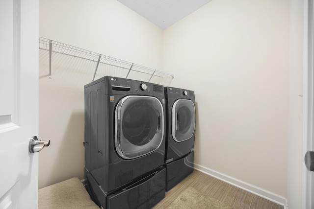 washroom featuring independent washer and dryer