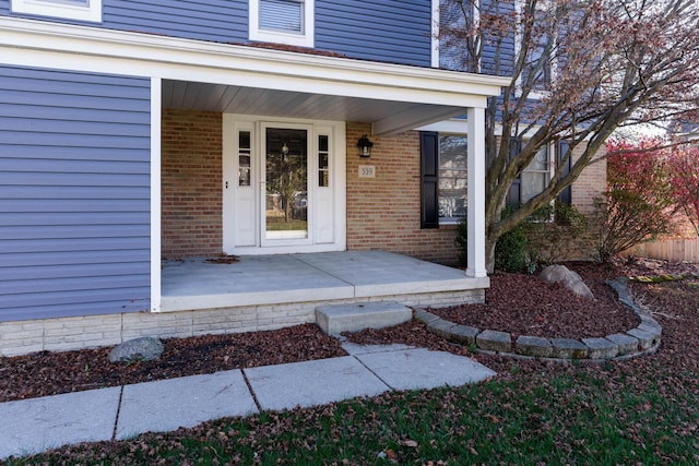 property entrance featuring covered porch