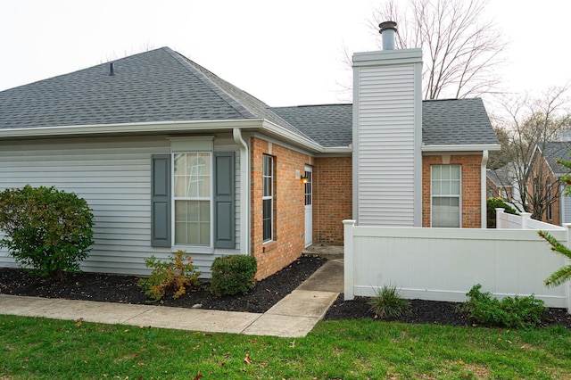 view of home's exterior featuring a yard