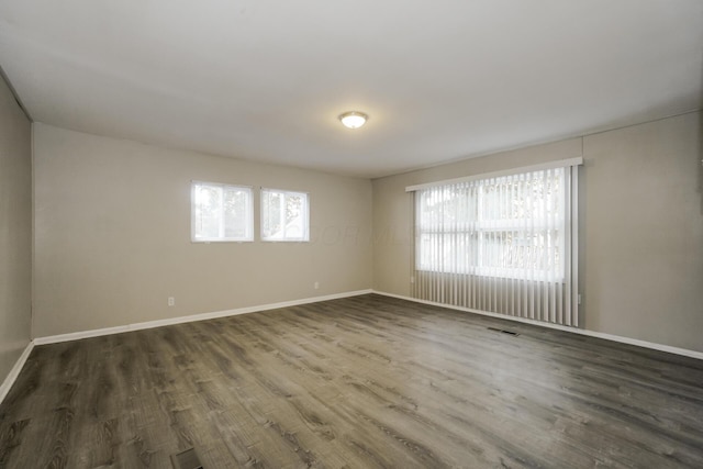 empty room featuring dark hardwood / wood-style floors