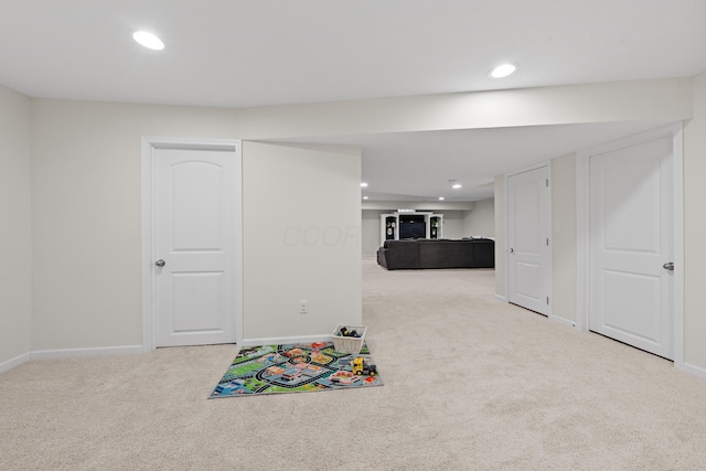 playroom with light colored carpet