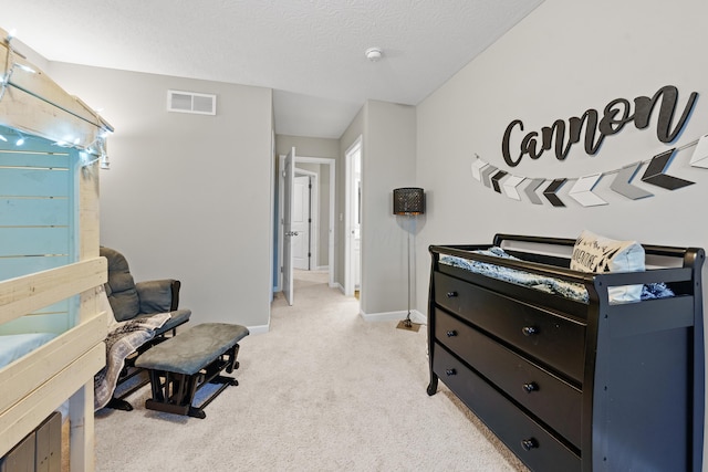 living area with a textured ceiling and light colored carpet