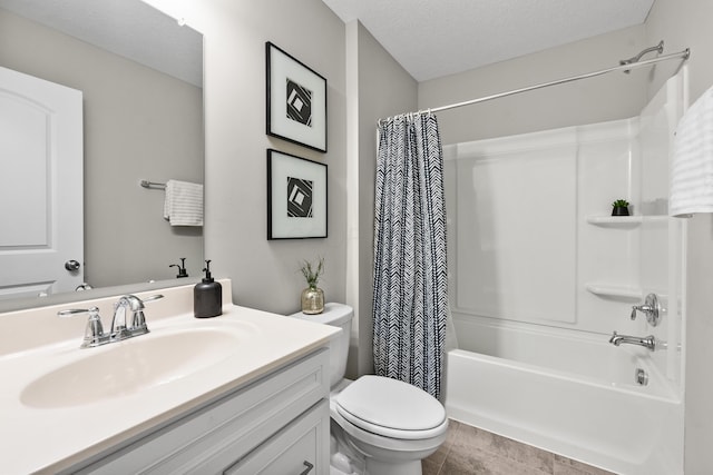 full bathroom featuring tile patterned floors, vanity, a textured ceiling, shower / bathtub combination with curtain, and toilet