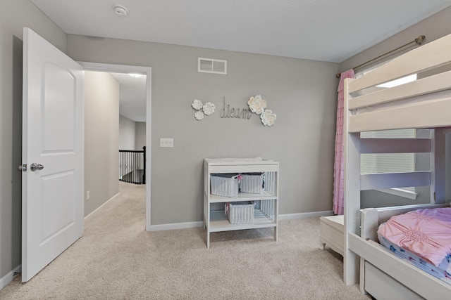 bedroom with light carpet