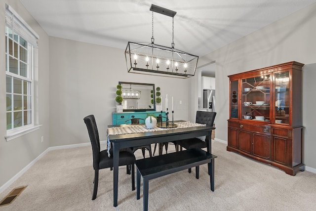 view of carpeted dining space