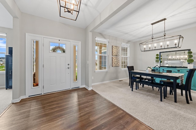 entryway featuring a healthy amount of sunlight and dark hardwood / wood-style floors