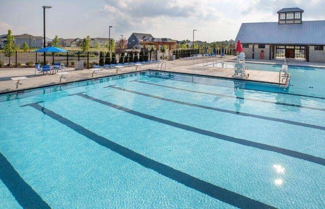 view of pool featuring a patio area