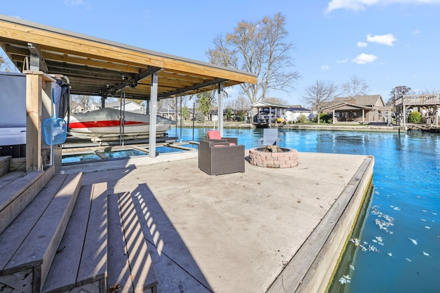 dock area featuring a water view and an outdoor fire pit