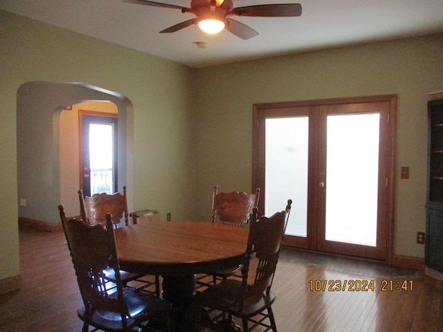 dining space featuring hardwood / wood-style flooring, ceiling fan, and french doors