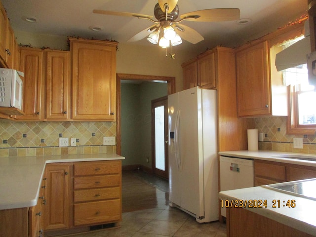 kitchen featuring ceiling fan, sink, backsplash, white appliances, and light tile patterned flooring