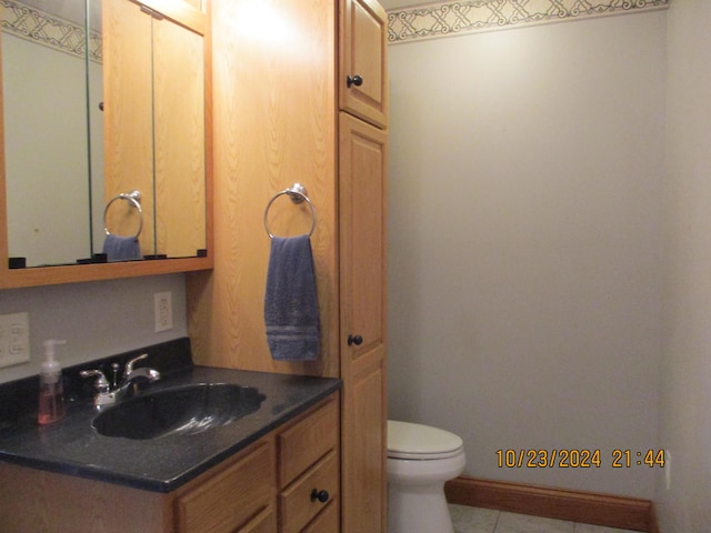 bathroom featuring vanity and toilet