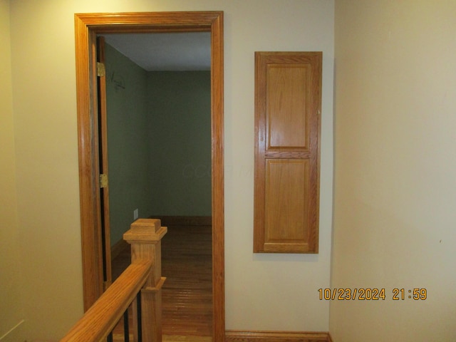 hall with hardwood / wood-style floors