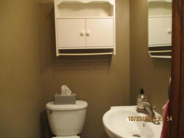 bathroom with toilet and sink