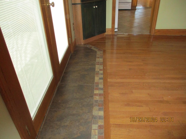 hallway featuring dark hardwood / wood-style floors