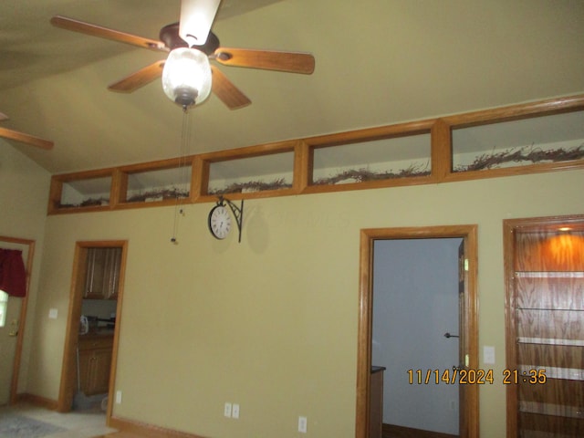 unfurnished room featuring ceiling fan and lofted ceiling