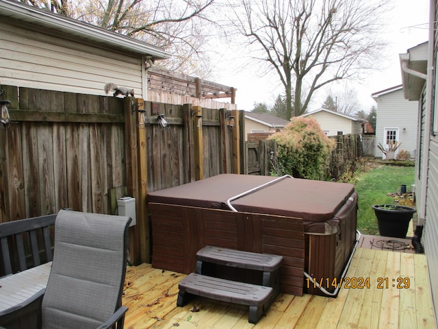 deck featuring a hot tub