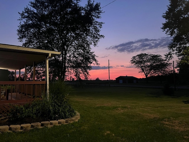 view of yard at dusk