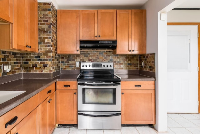 kitchen with ventilation hood, light tile patterned flooring, tasteful backsplash, and stainless steel electric stove