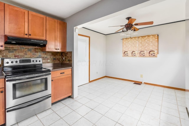 kitchen with tasteful backsplash, stainless steel electric range oven, ceiling fan, and light tile patterned flooring