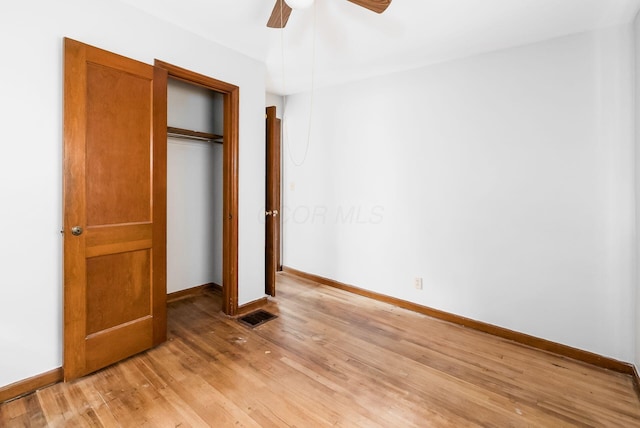 unfurnished bedroom with a closet, ceiling fan, and light hardwood / wood-style flooring