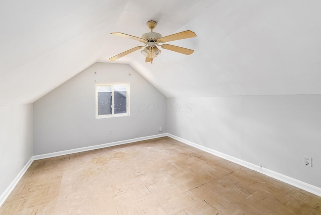 additional living space with ceiling fan and lofted ceiling