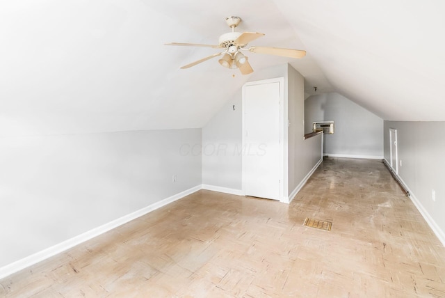 bonus room with ceiling fan and vaulted ceiling