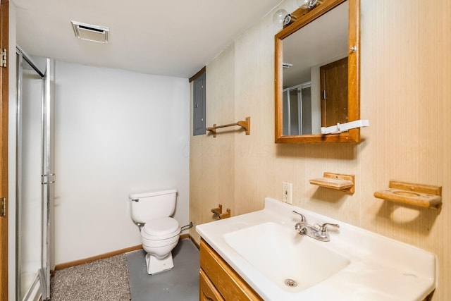 bathroom with vanity, toilet, a shower with shower door, and electric panel