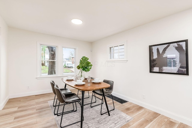 dining space featuring light hardwood / wood-style flooring