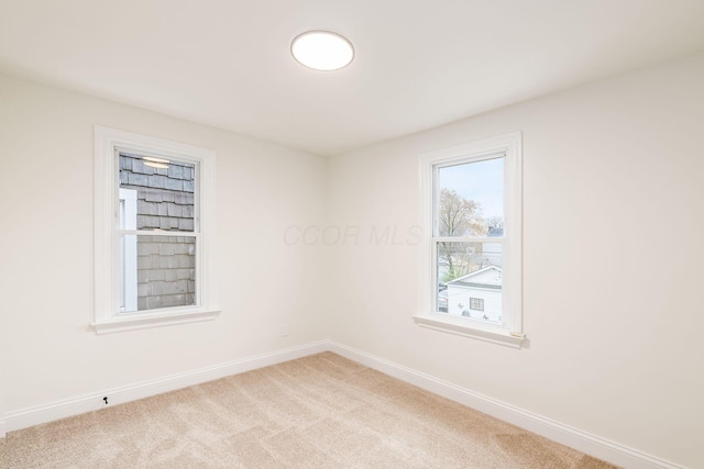 unfurnished room featuring carpet floors