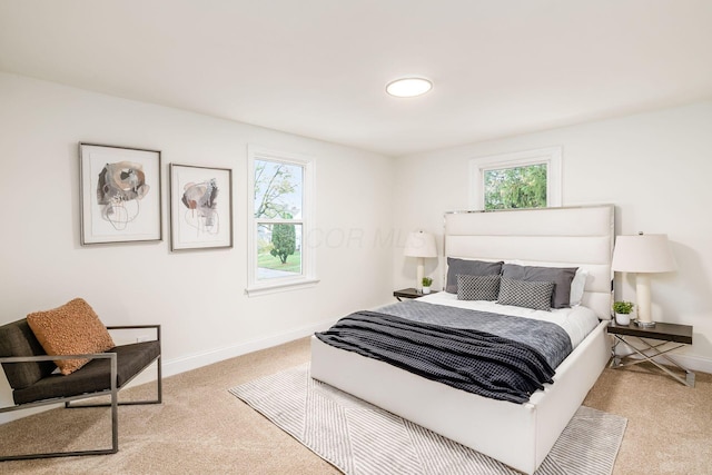 bedroom with light colored carpet