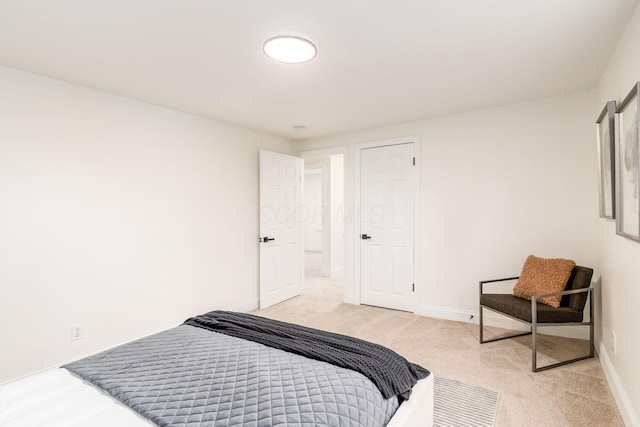 bedroom with light carpet