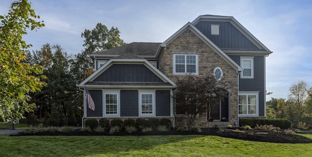 craftsman-style home with a front lawn