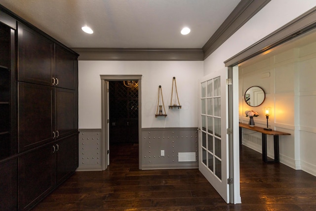 corridor featuring dark hardwood / wood-style flooring and ornamental molding