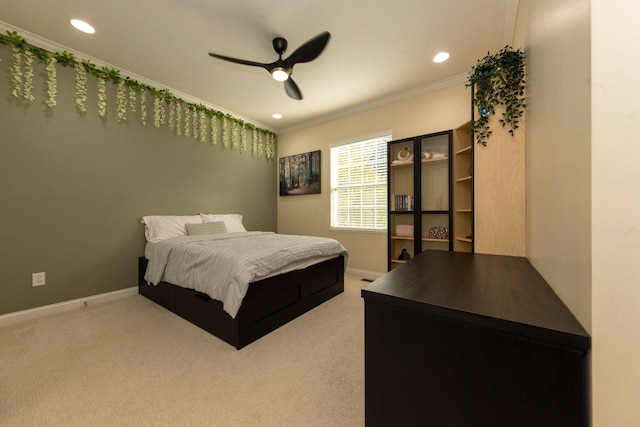 bedroom with carpet, ceiling fan, and ornamental molding