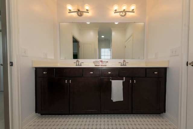 bathroom featuring vanity and ornamental molding