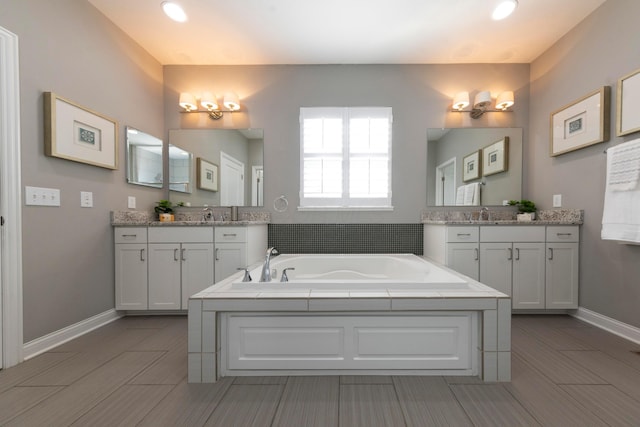 bathroom featuring vanity and a bathtub