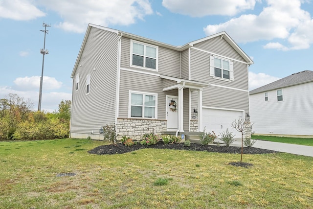 view of front of property featuring a front yard and a garage