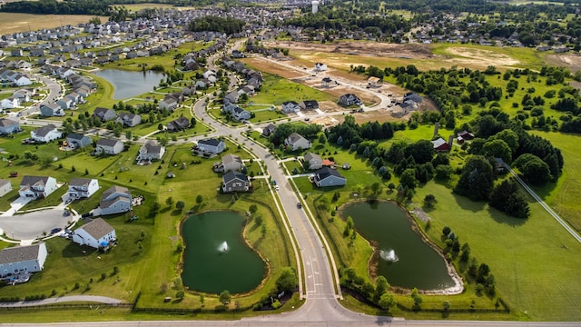 aerial view with a residential view and a water view