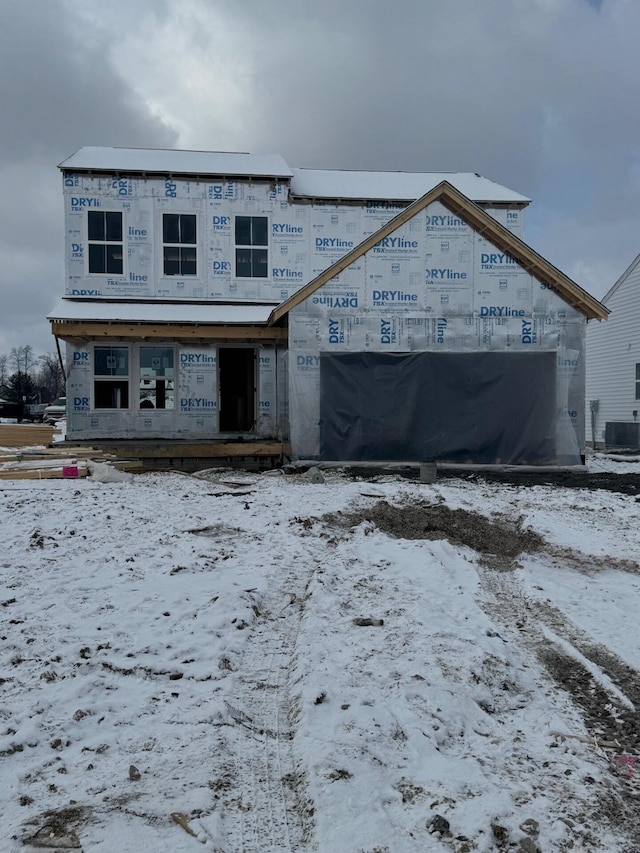 unfinished property featuring central AC unit