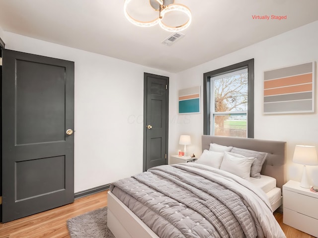 bedroom with light wood-type flooring