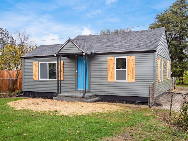 bungalow with a front yard